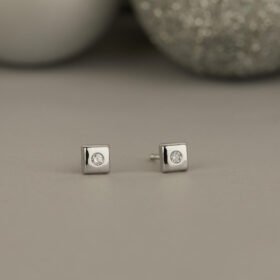 A SCHOOL GIRL'S DIAMOND (WHITE GOLD) EARRINGS FOR BABY GIRL
